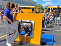  little boy climbs through a window of a school bus during a demonstration.